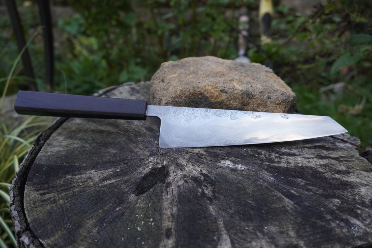 Hand Made Kiritsuke 185mm. Takefu V-Toku2 Core Suminagashi with carbon cladding.  Repurposed Rosewood