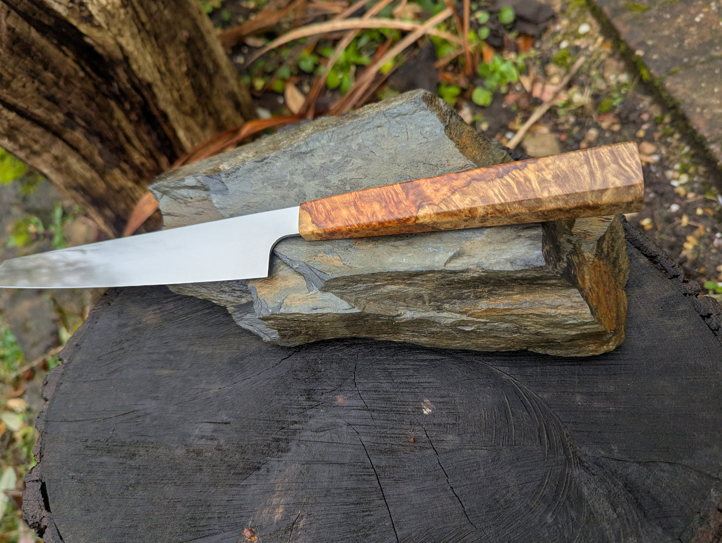 Hand made 7" Damasteel RWL34 stainless steel. Natural Amboyna burl