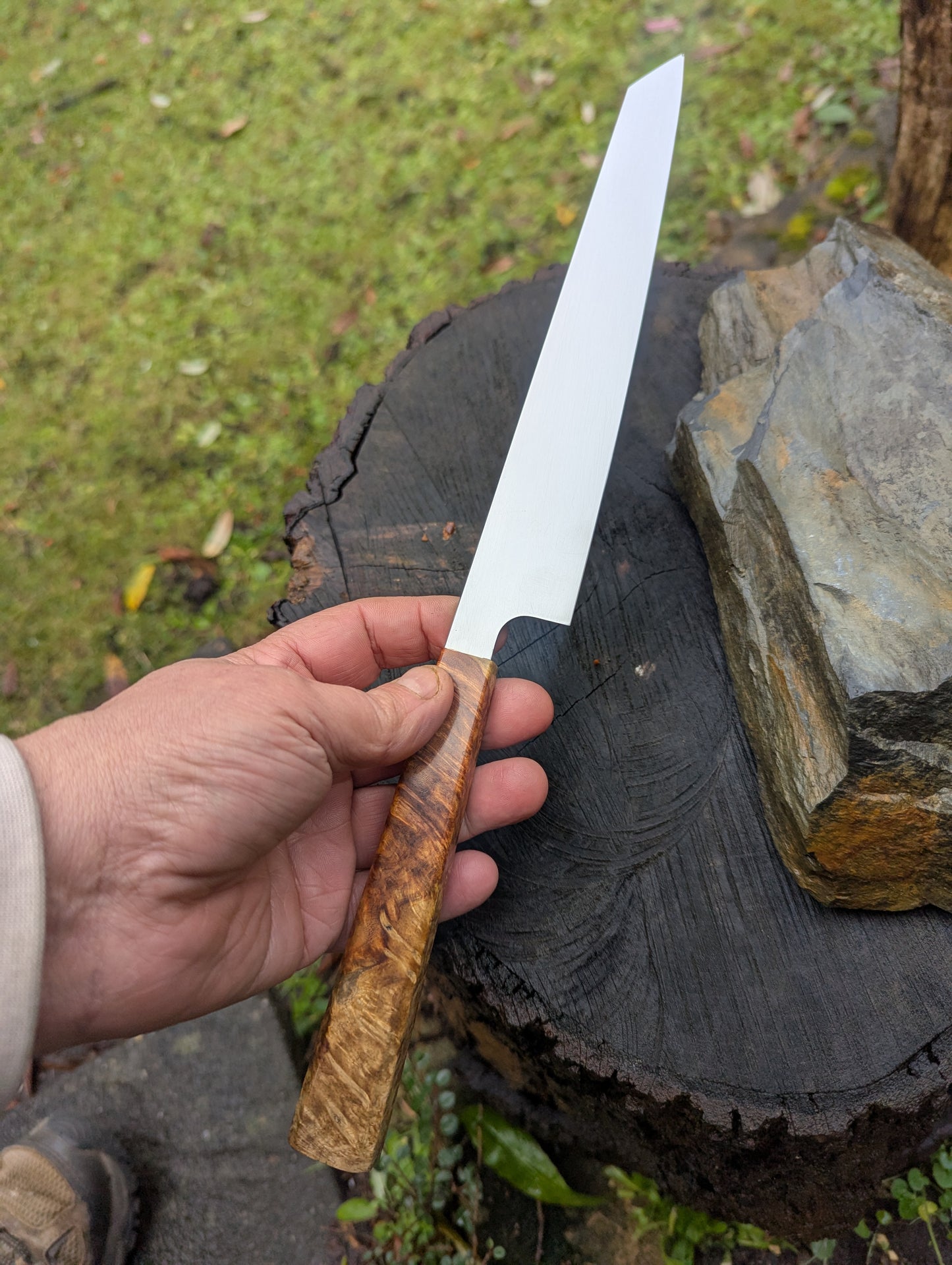 Hand made 7" Damasteel RWL34 stainless steel. Natural Amboyna burl