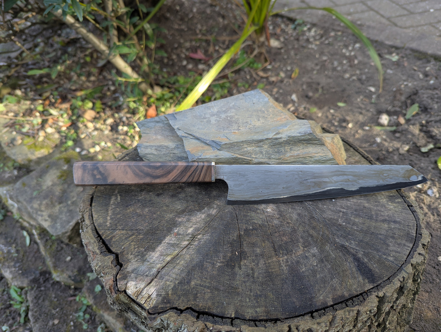 Hand made 8" carbon steel core and Wrought iron cladding with nickel San Mai. Turkish walnut with nickel silver