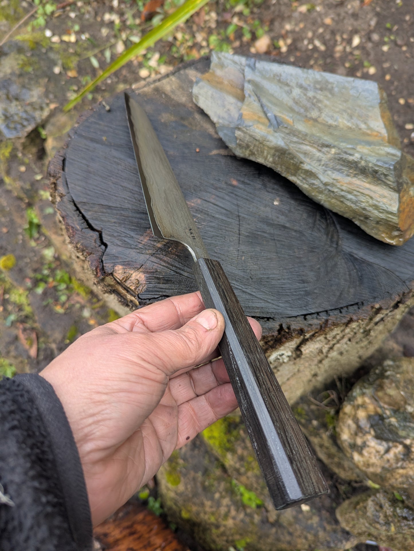 Hand made 8" carbon steel core and Wrought iron cladding with nickel San Mai. 5600 years old Bog Oak