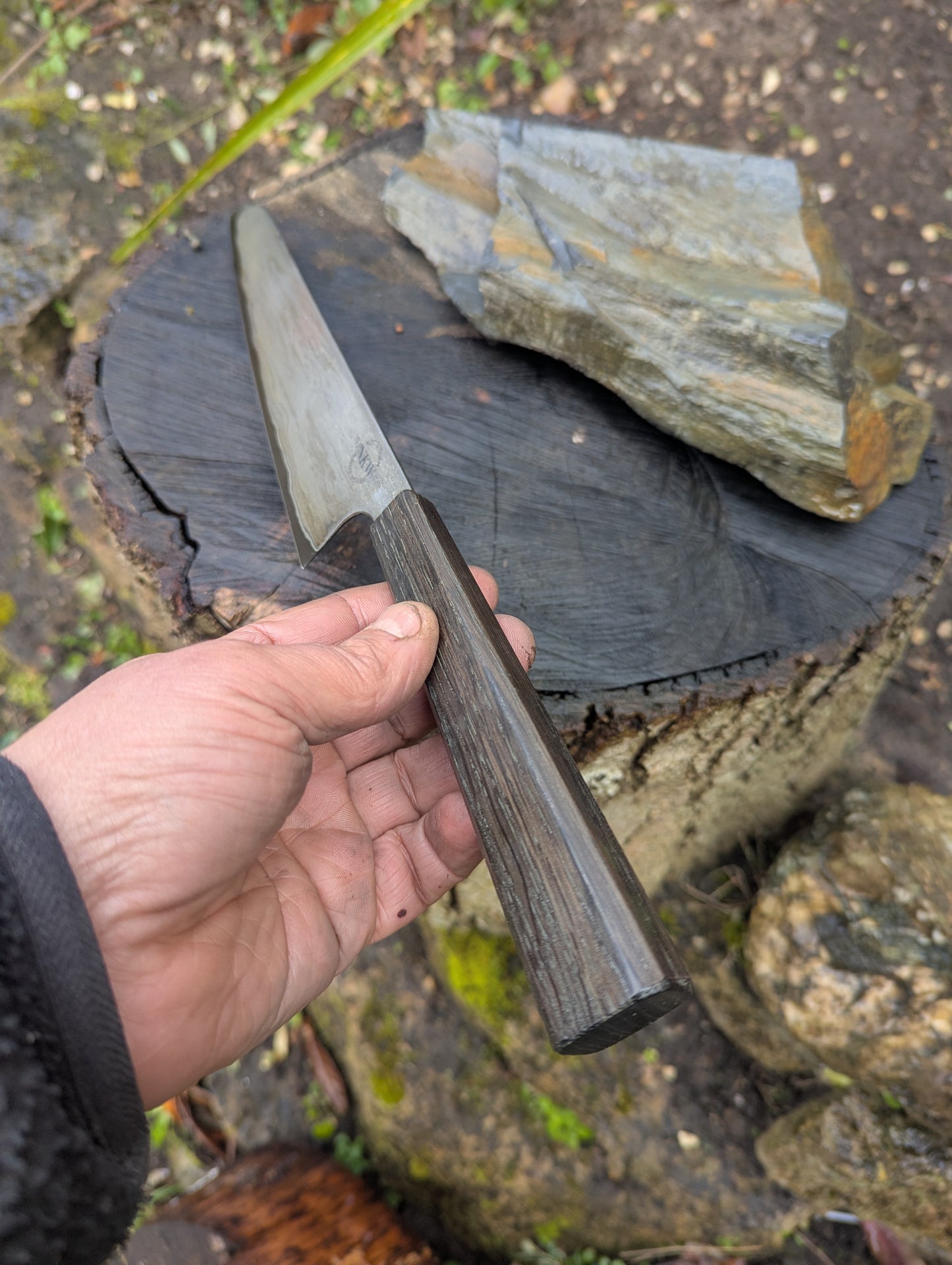 Hand made 8" carbon steel core and Wrought iron cladding with nickel San Mai. 5600 years old Bog Oak