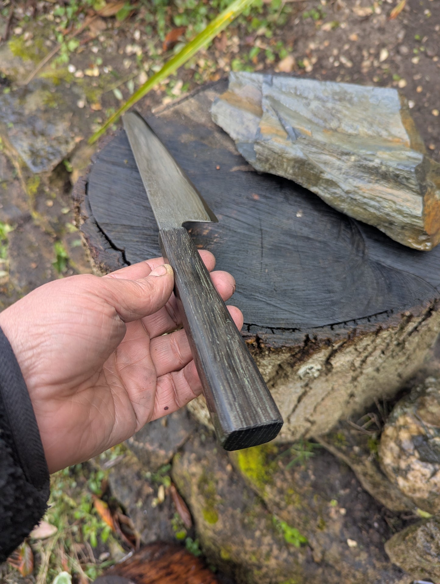 Hand made 8" carbon steel core and Wrought iron cladding with nickel San Mai. 5600 years old Bog Oak