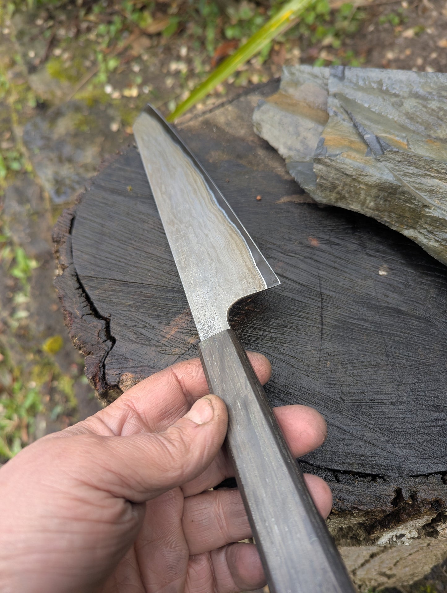 Hand made 8" carbon steel core and Wrought iron cladding with nickel San Mai. 5600 years old Bog Oak