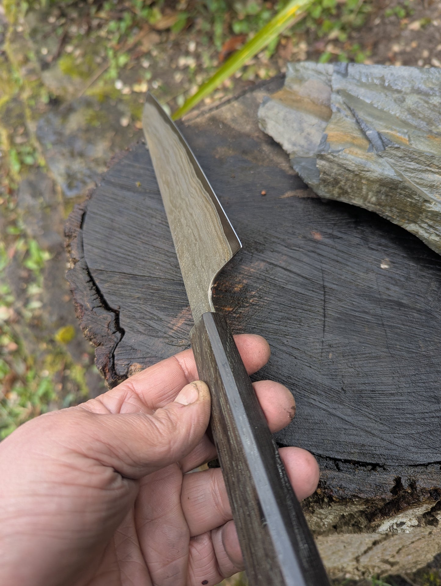 Hand made 8" carbon steel core and Wrought iron cladding with nickel San Mai. 5600 years old Bog Oak