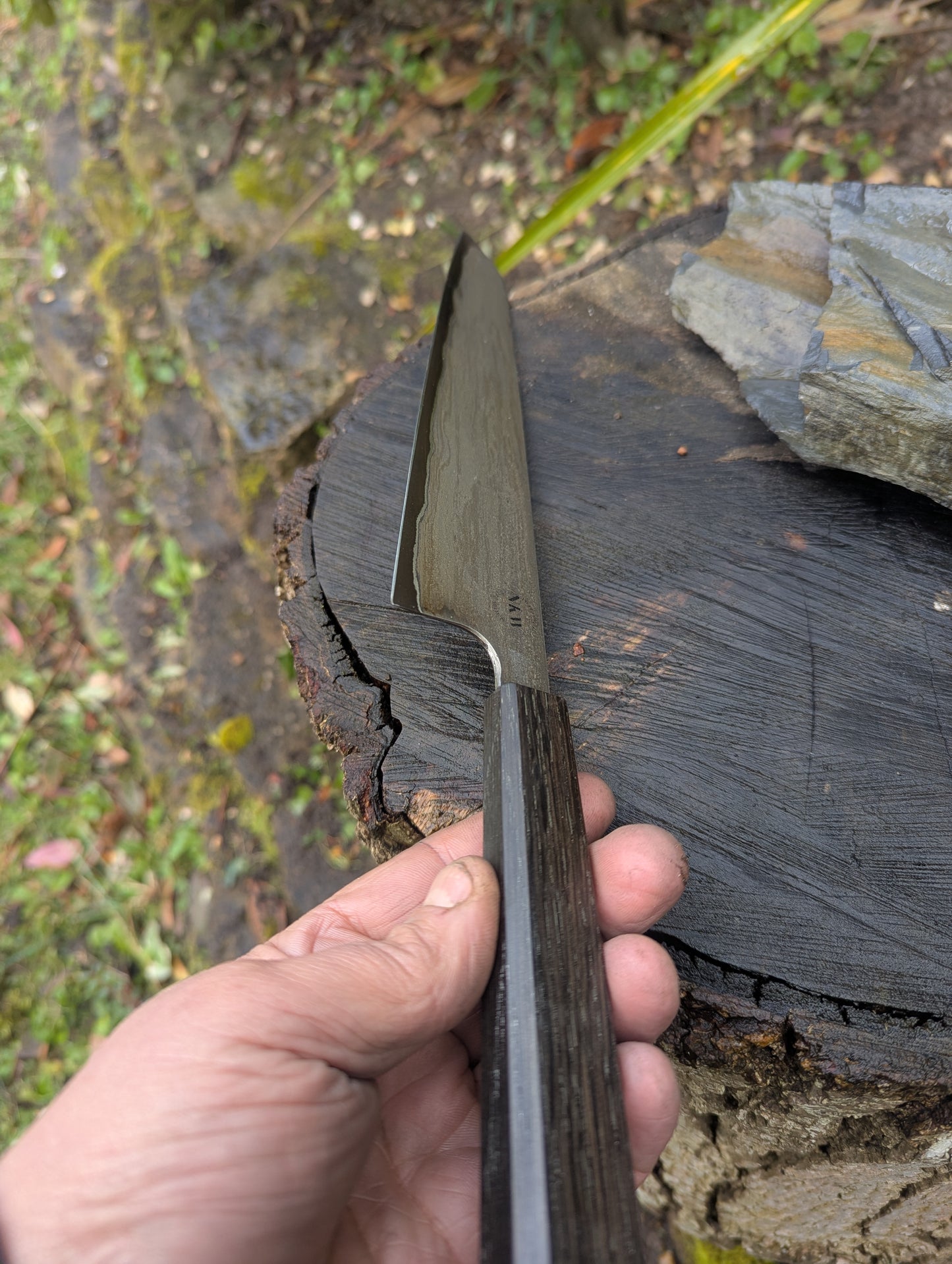 Hand made 8" carbon steel core and Wrought iron cladding with nickel San Mai. 5600 years old Bog Oak