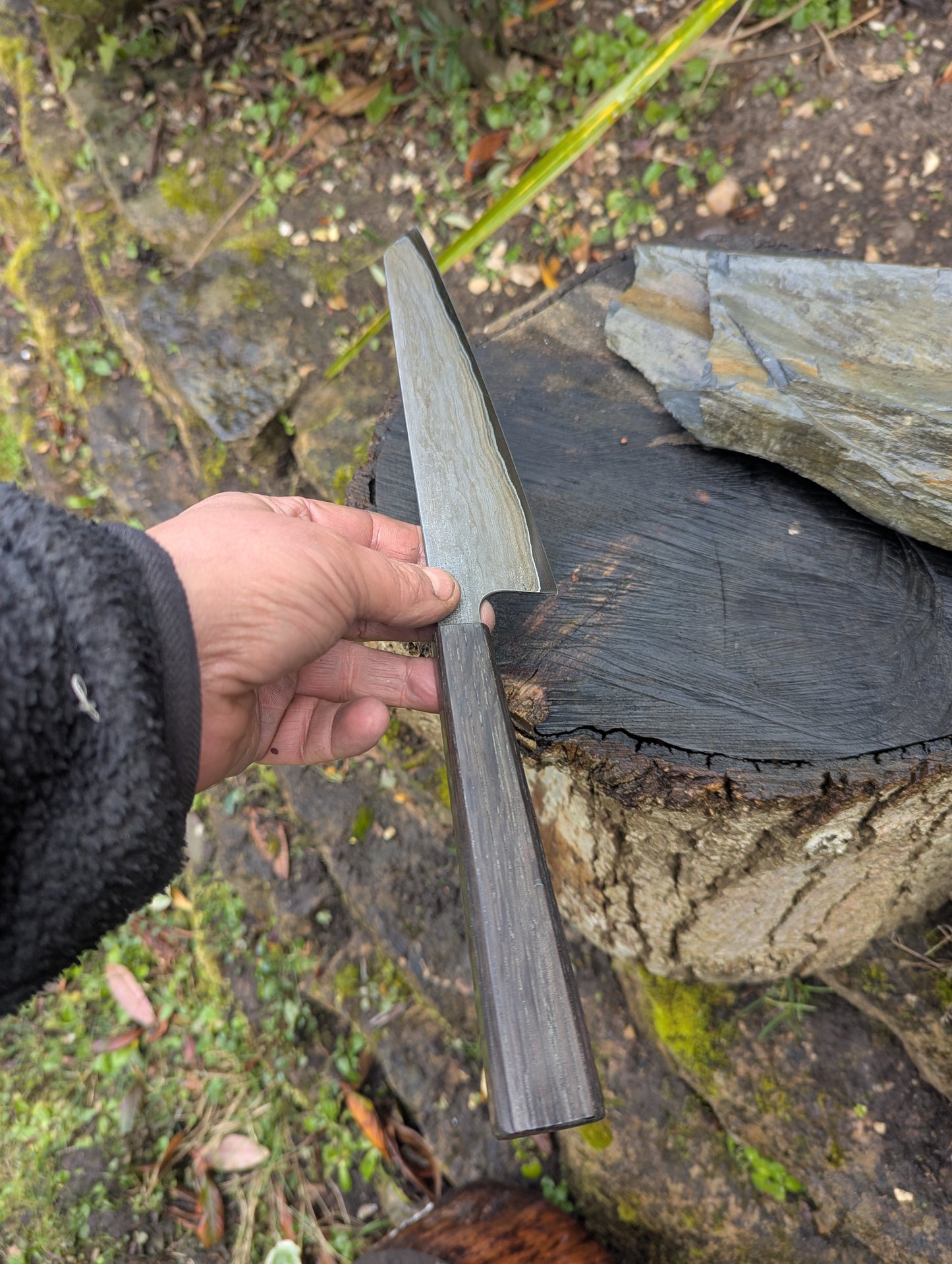 Hand made 8" carbon steel core and Wrought iron cladding with nickel San Mai. 5600 years old Bog Oak