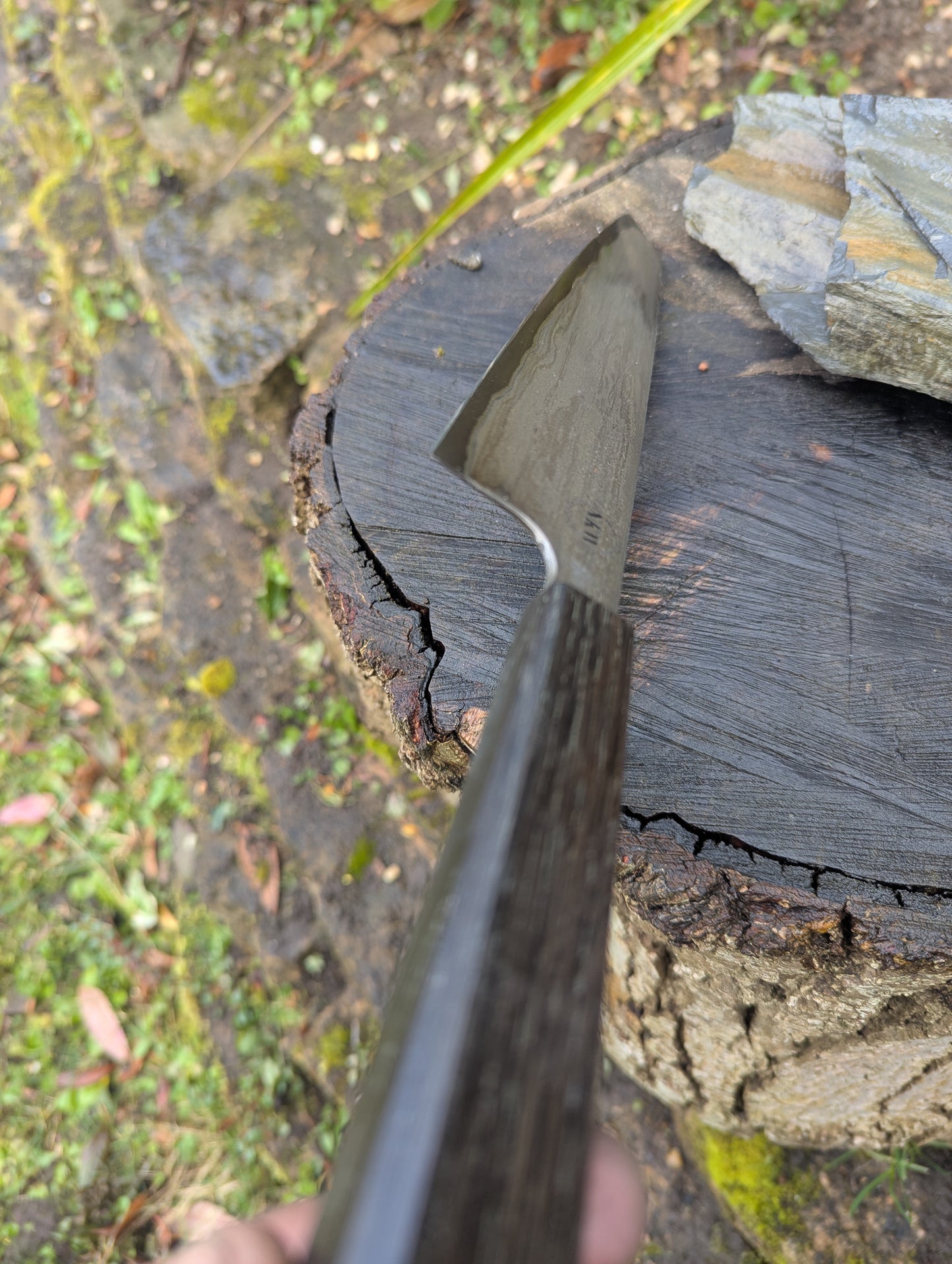 Hand made 8" carbon steel core and Wrought iron cladding with nickel San Mai. 5600 years old Bog Oak