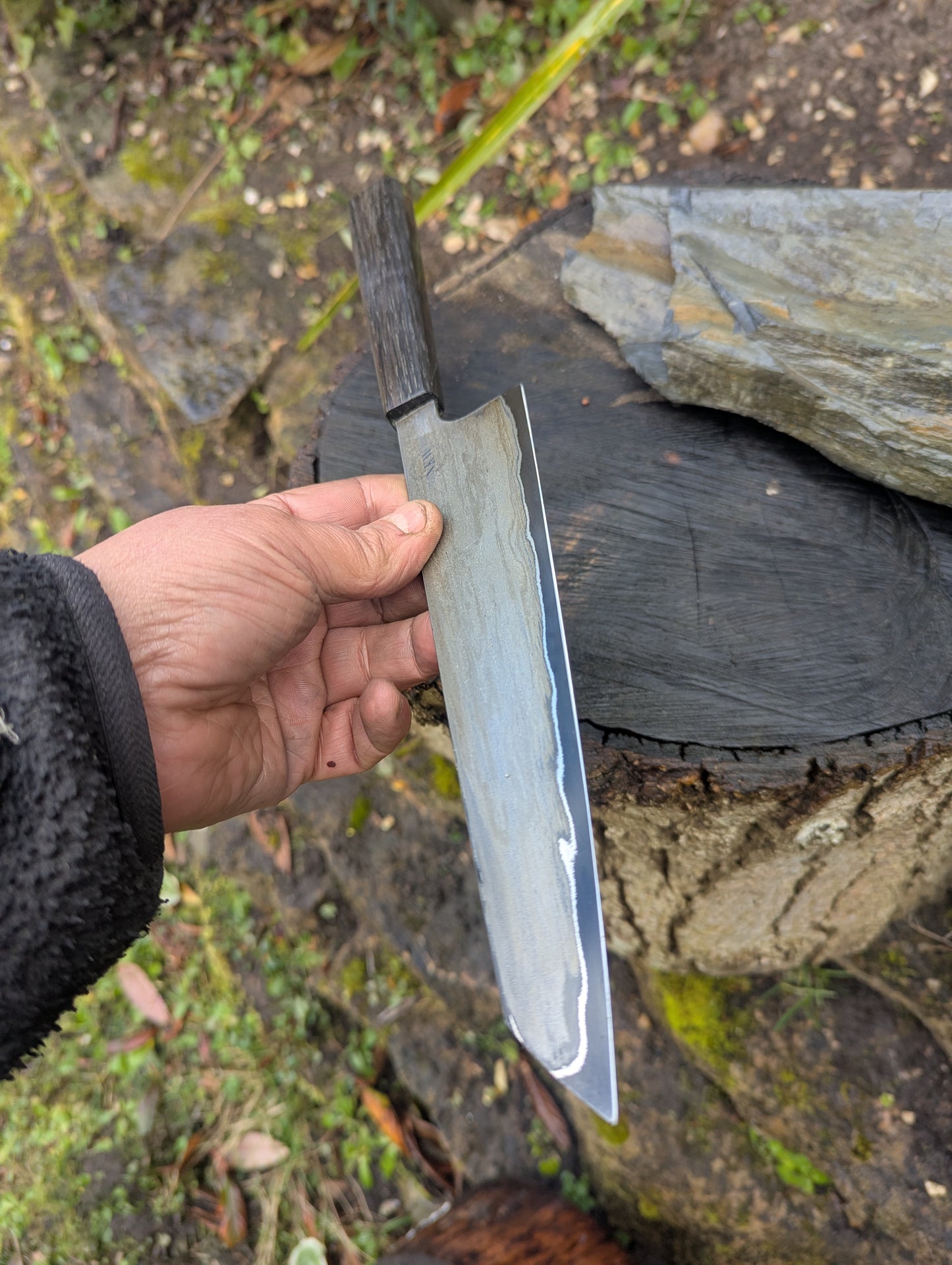 Hand made 8" carbon steel core and Wrought iron cladding with nickel San Mai. 5600 years old Bog Oak