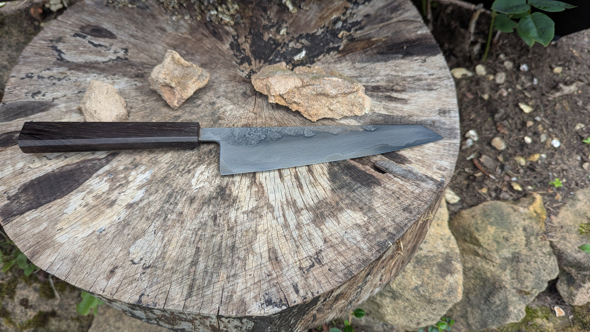 Hand Made Kiritsuke 185mm. Takefu V-Toku2 Core Suminagashi with carbon cladding.  Repurposed Rosewood